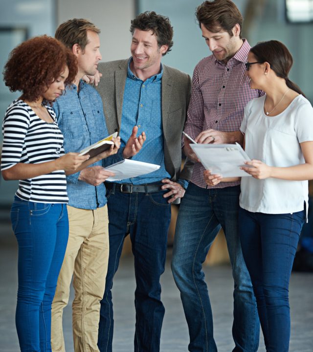 Teamwork, discussion or business people with ideas in meeting for brainstorming as a group in office. Diversity, collaboration or employees networking or planning with notes or documents in workplace.